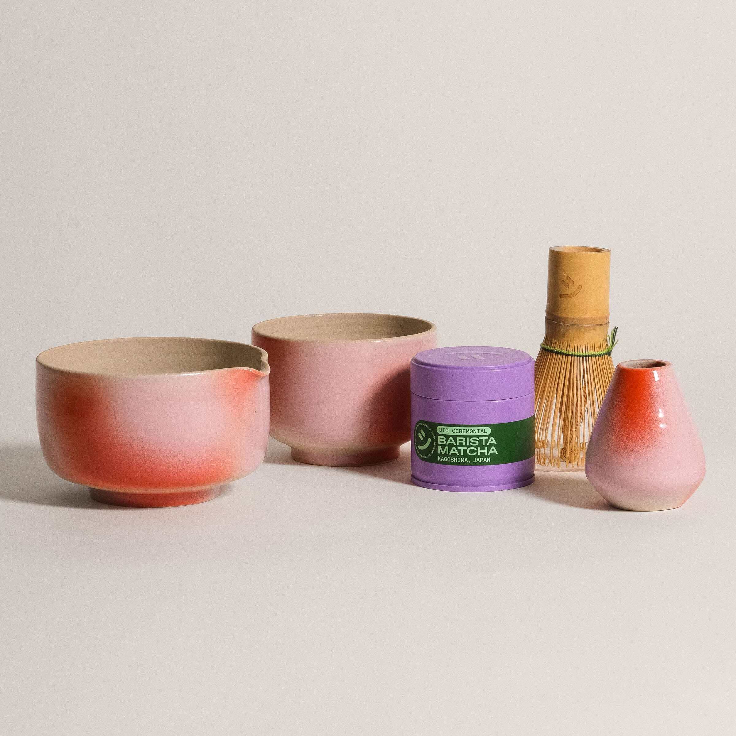 Matcha Sets featuring ceramic bowls, a matcha whisk, and Barista Matcha canister in pink hues.