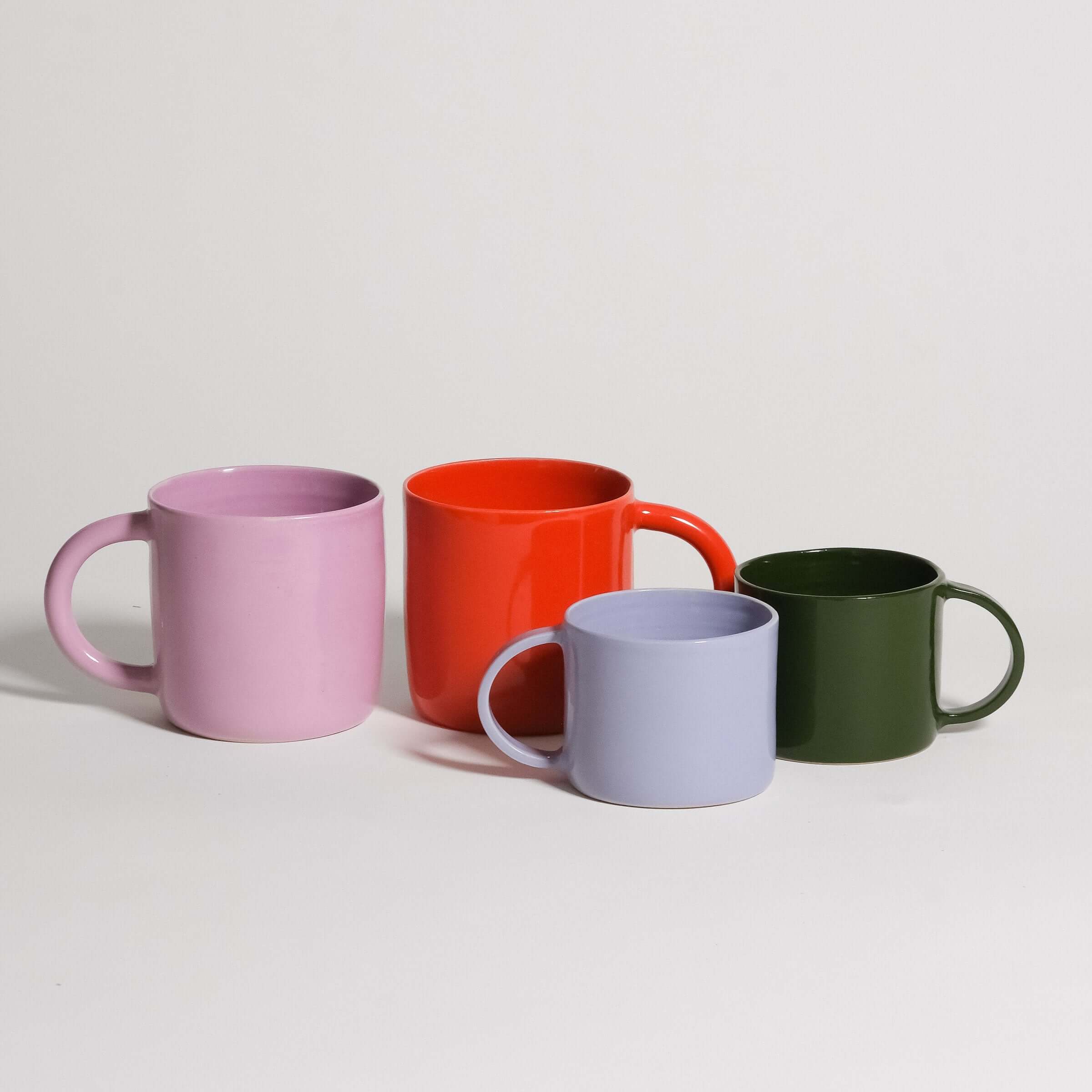 Colorful Cup & Mug Sets featuring pink, red, blue, and green mugs arranged together.
