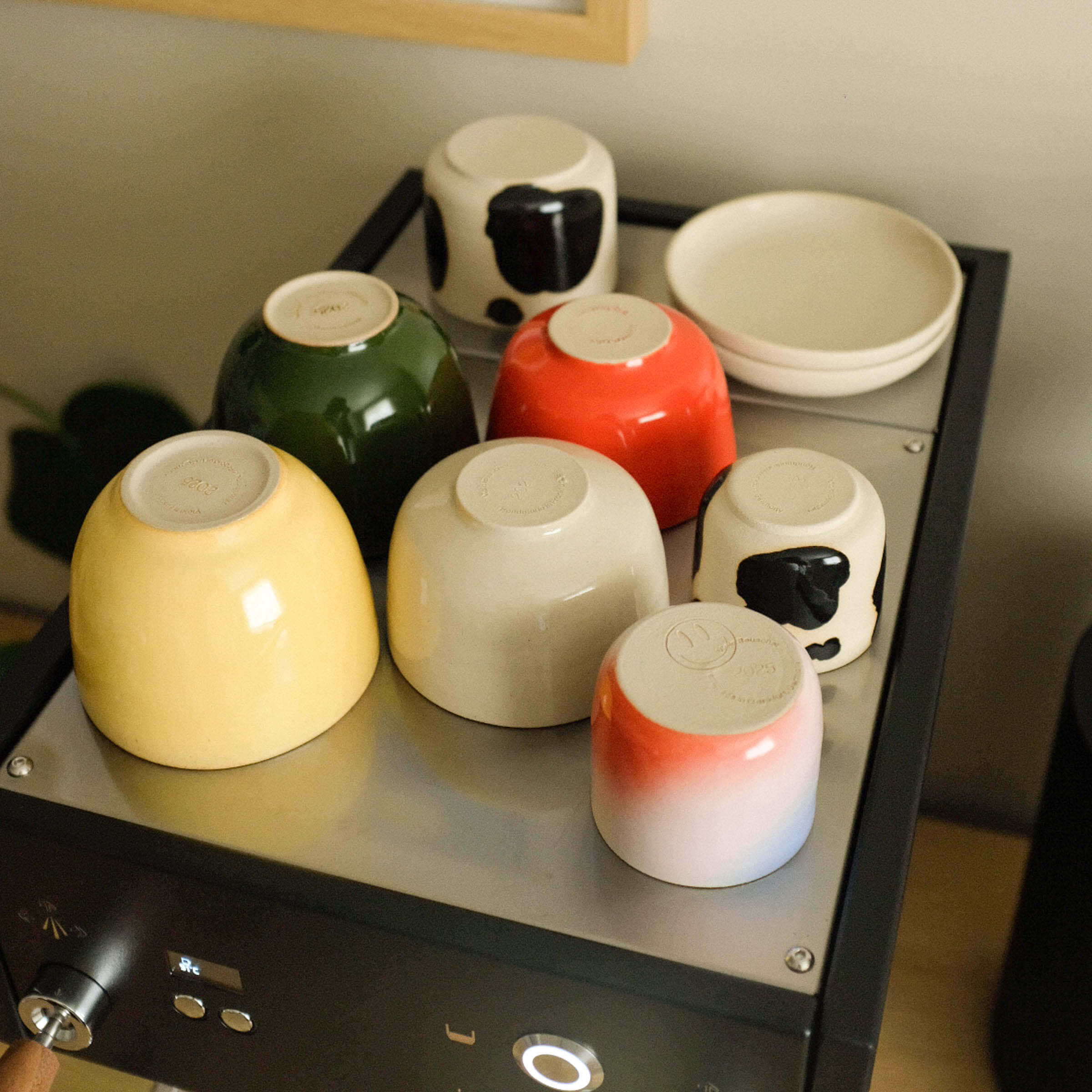 Colorful handmade ceramic cups and bowls from our Cups collection, crafted for everyday use in Frankfurt.