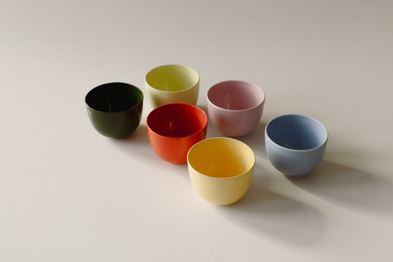 Coffee Cups on a dining table paired with desserts, showcasing a cozy atmosphere for enjoying hot beverages.