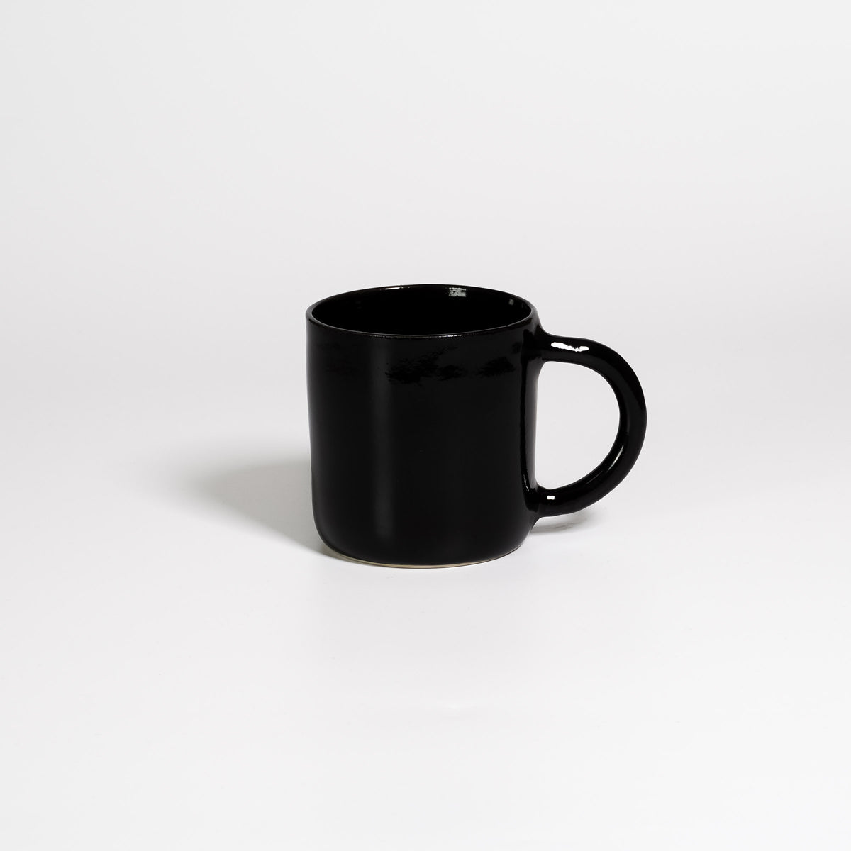 Coffee Mug Large Black, handled stoneware mug with glossy black glaze, handle to the right