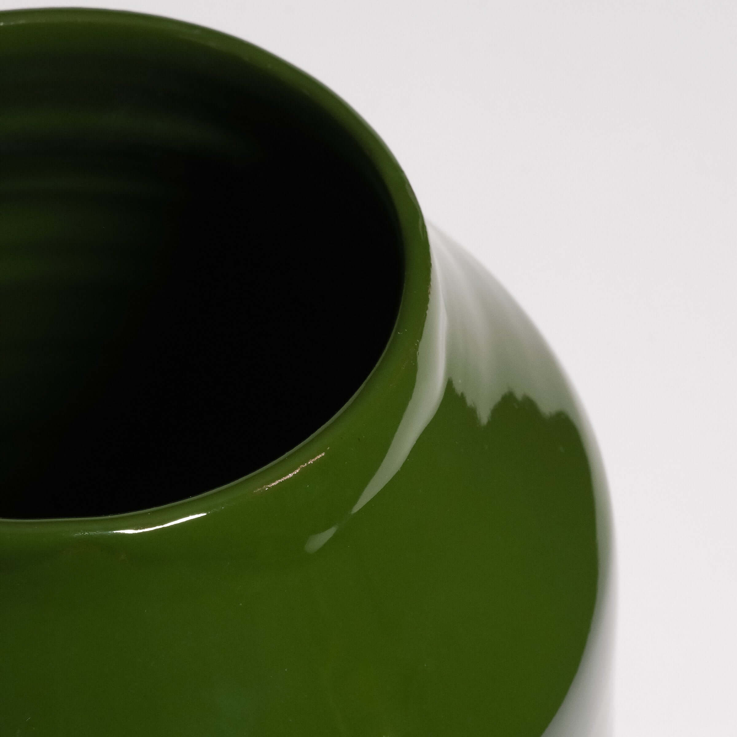 Close-up of the glossy green interior of a Big Vase – Green, highlighting its smooth ceramic finish.