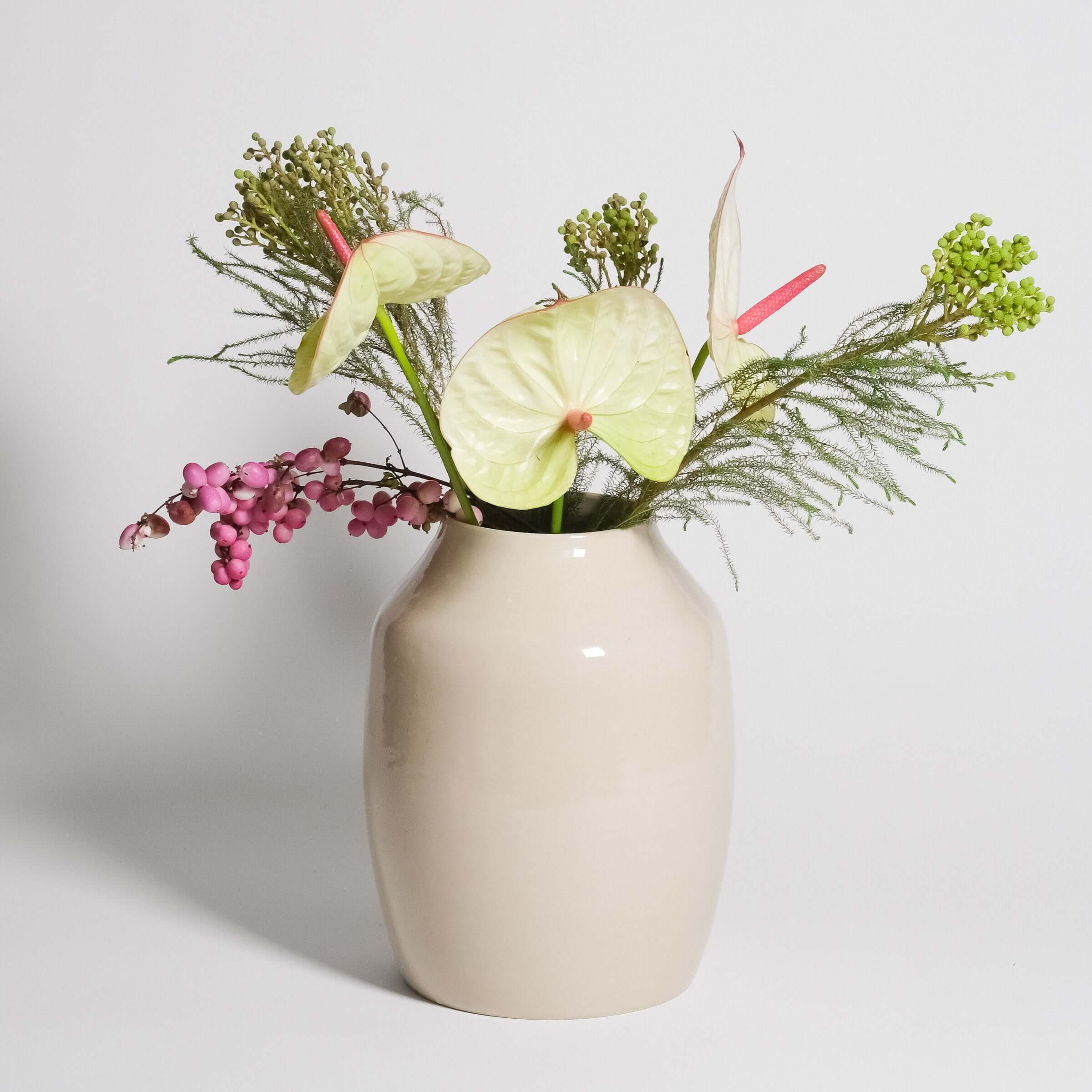 Big Vase – Creme filled with vibrant flowers, showcasing handmade ceramic craftsmanship and soft glossy finish.