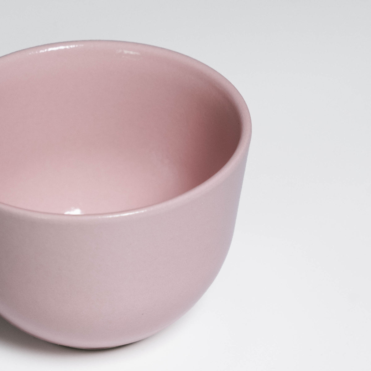 Coffee Cup Yun Pink seen from above, glossy soft pink glaze inside and out