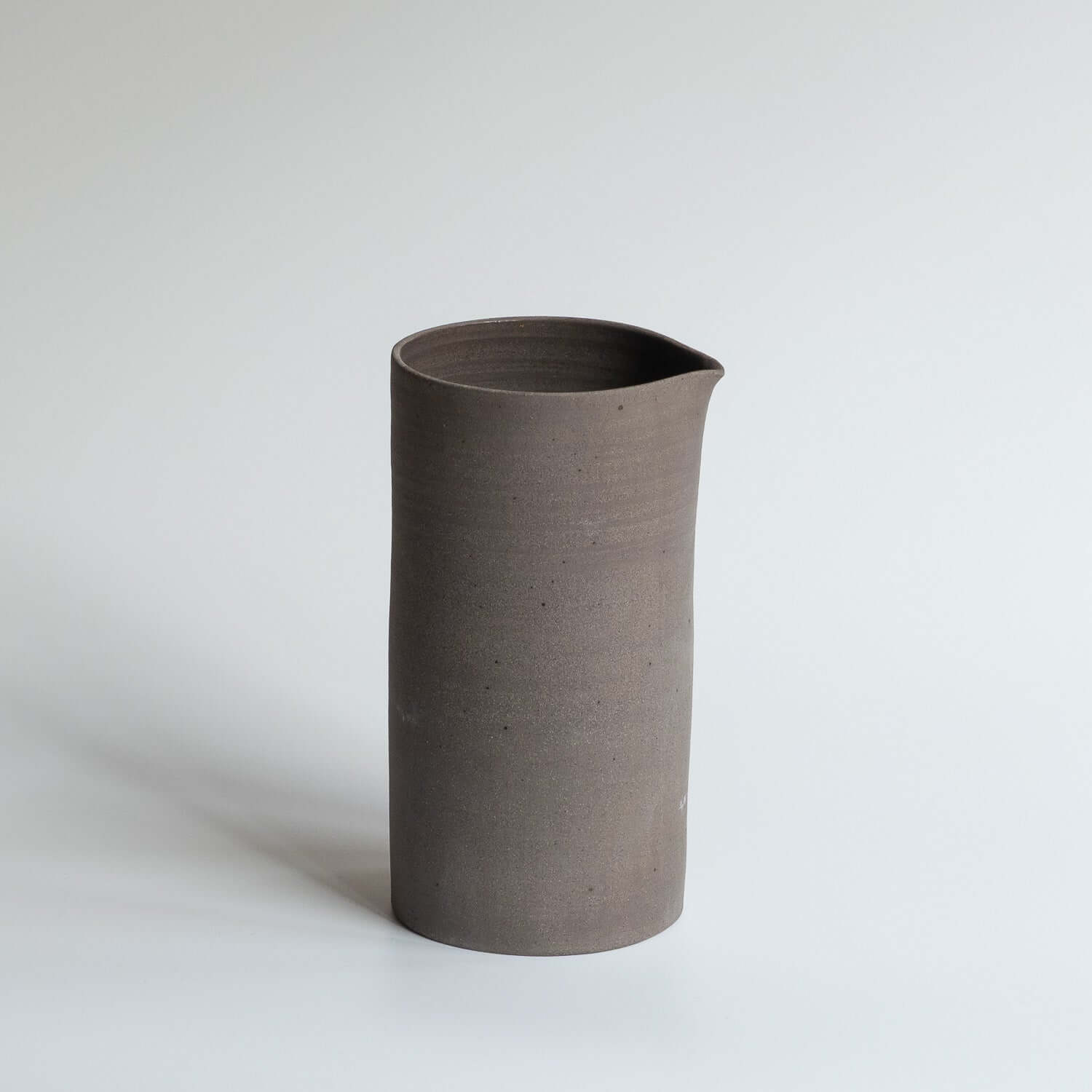 Carafe – Wild Clay, handcrafted from wild clay with a glossy finish, perfect for serving drinks.