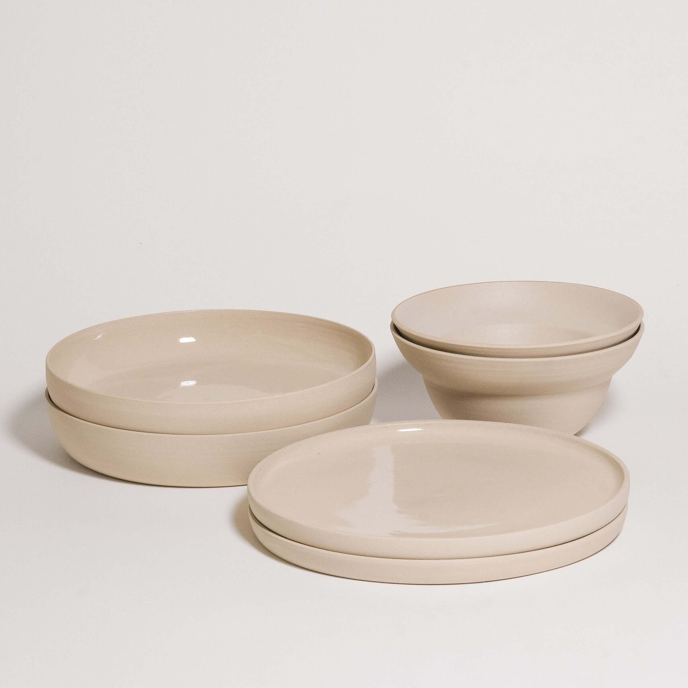 Mix & Match - Tableware Bundle featuring stacked bowls and plates in neutral tones.