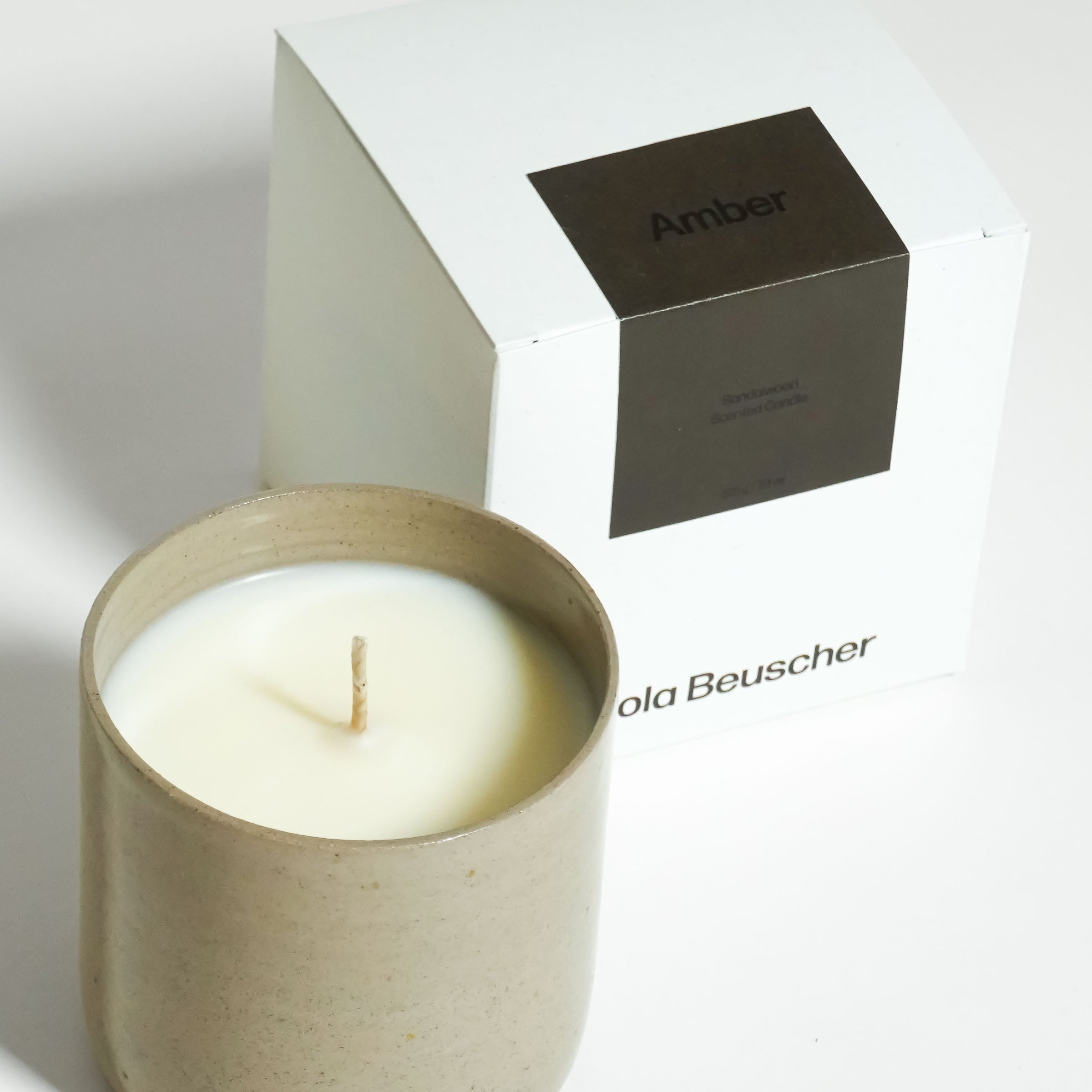 Scented Candle – Sandalwood – Amber in a ceramic cup with a white box packaging.