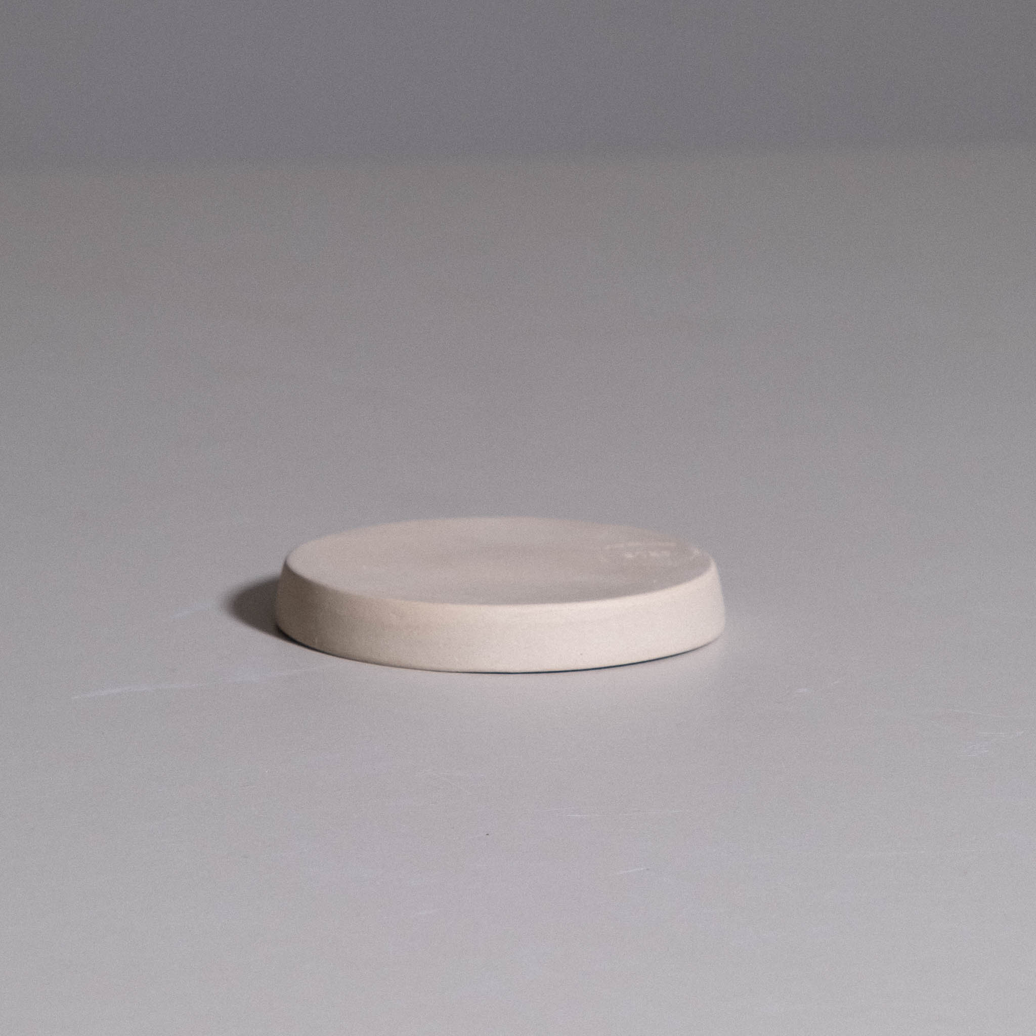 Saucer – Creme made from handmade ceramic with a creme glaze and hand-thrown form.