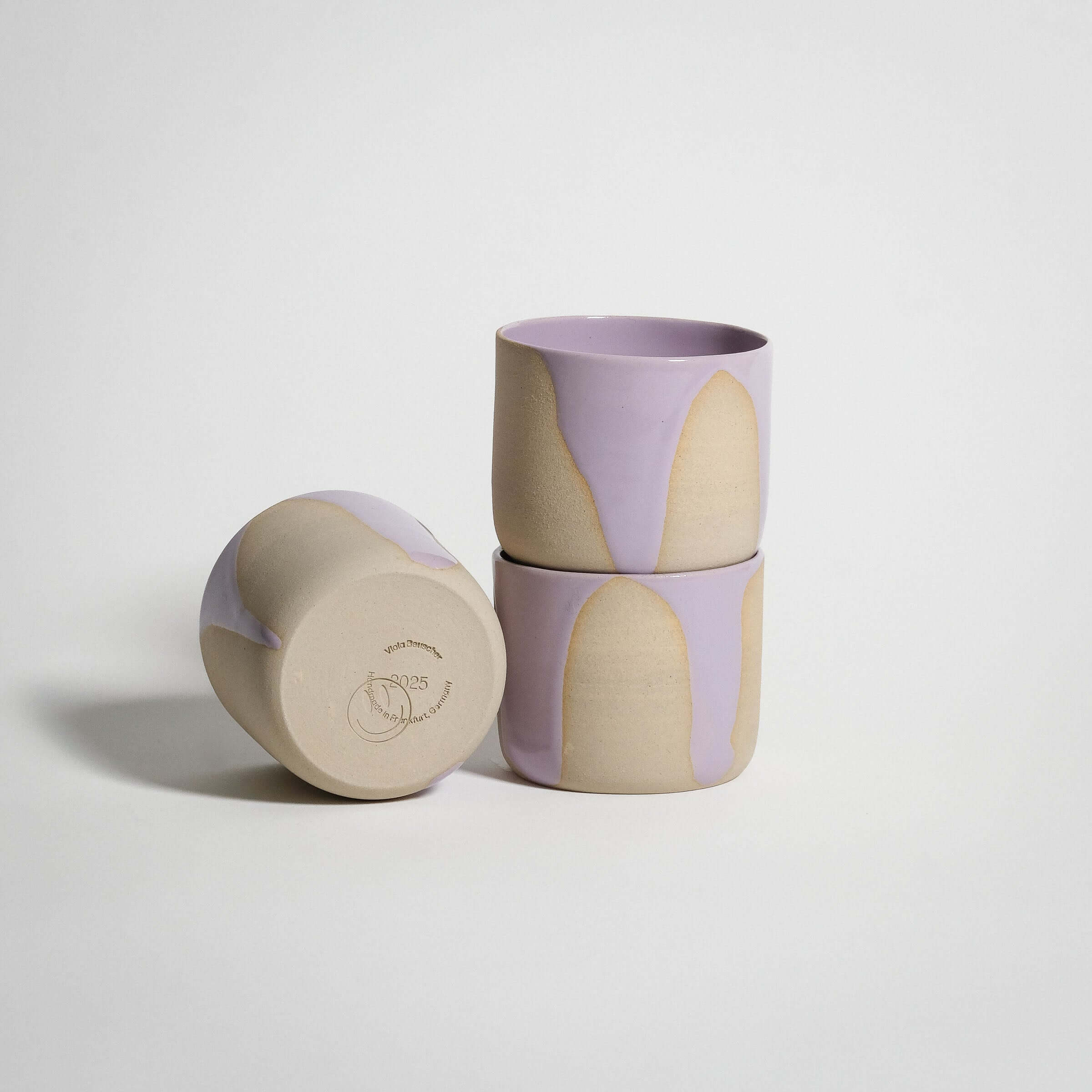 Set of 4 handcrafted coffee cups in lilac glaze, perfect for tea or coffee, made from grey stoneware clay.