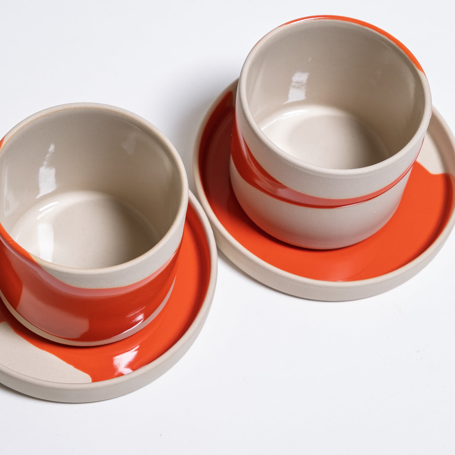 Happy Edition set of four handmade stoneware coffee cups in mixed colours