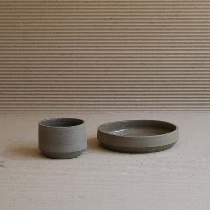 Embrace natural elegance with our Terroir Cup & Plate, crafted from wild clay for a unique, groggy finish. Perfect for discerning tastes. from viola beuscher ceramics