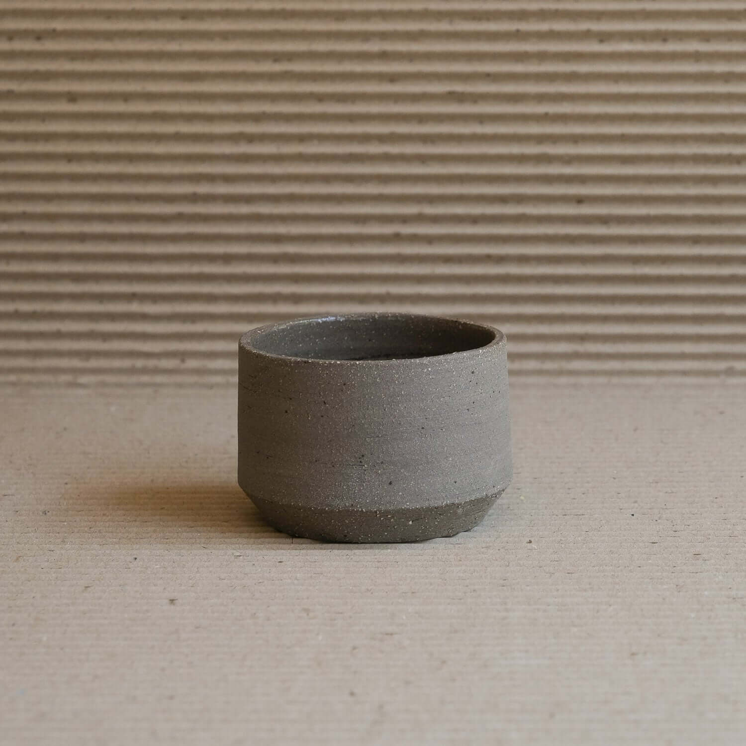 Embrace natural elegance with our Terroir Cup & Plate, crafted from wild clay for a unique, groggy finish. Perfect for discerning tastes. from viola beuscher ceramics