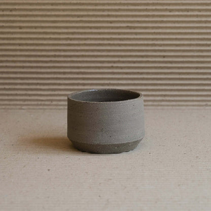 Embrace natural elegance with our Terroir Cup & Plate, crafted from wild clay for a unique, groggy finish. Perfect for discerning tastes. from viola beuscher ceramics