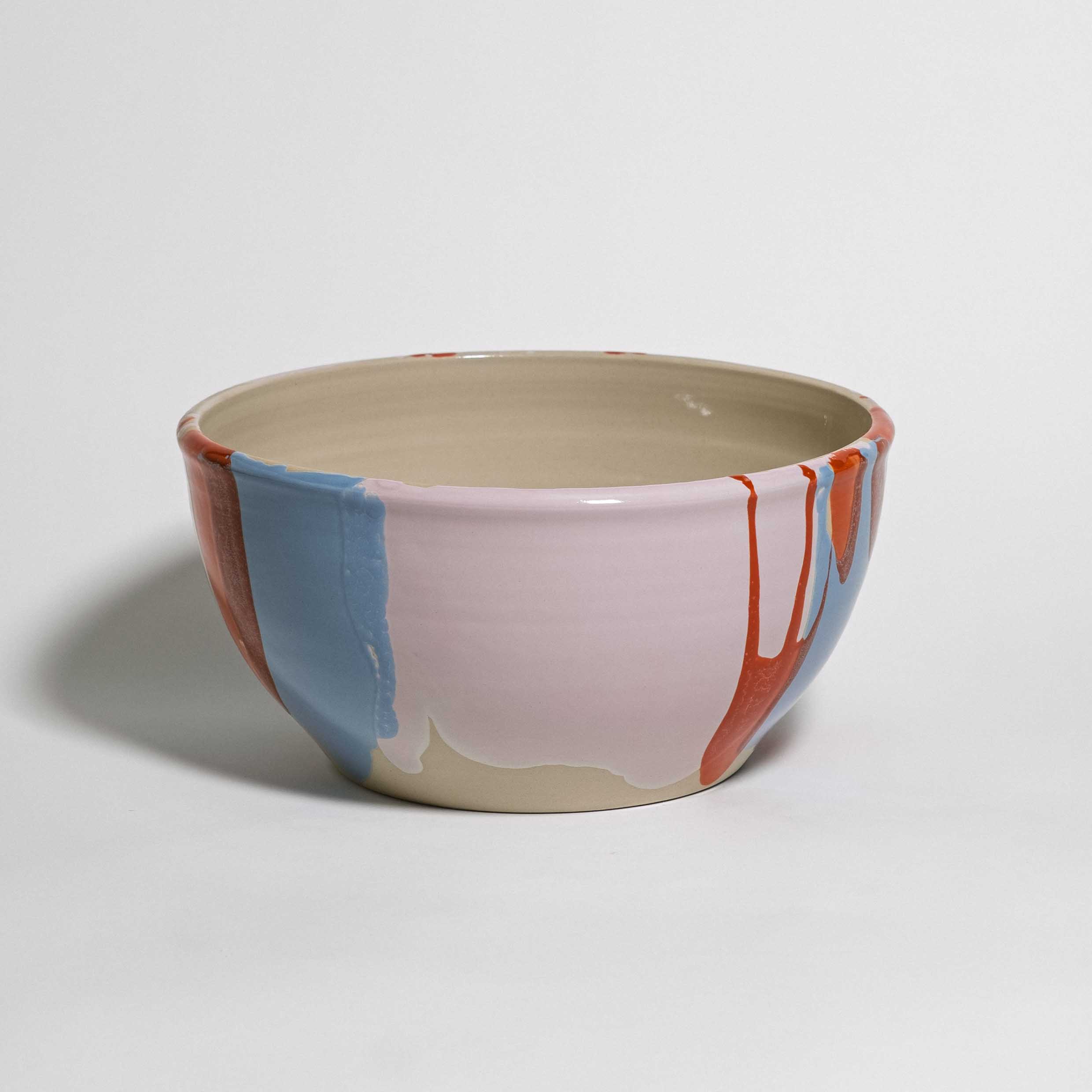 Handmade one-of-a-kind ceramic serving bowl, cream interior with red and blue glaze splashes, by Viola Beuscher