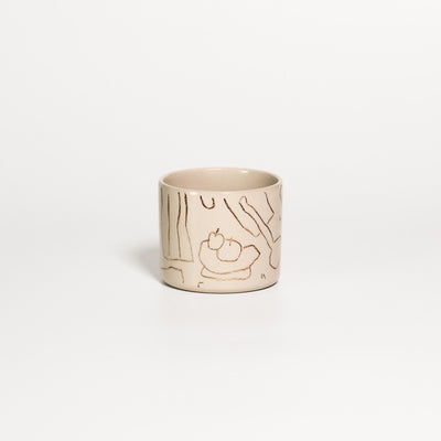 Creme stoneware coffee cup with a fine brown line drawing of a fruit bowl and table scene by Steffi Bauer under clear gloss glaze