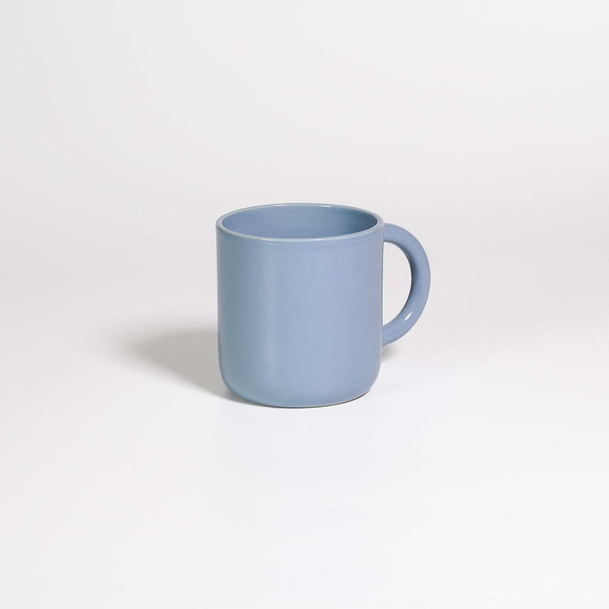 Coffee Mug Large Iceblue, handled stoneware mug with glossy ice blue glaze, handle turned away