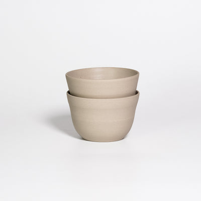 Two Neo Coffee Cups White Matte stacked, handleless stoneware cups, white matte inside and raw clay outside