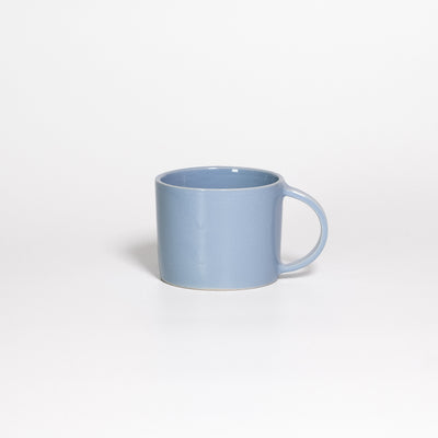 Coffee Mug Iceblue, low wide handled stoneware mug with glossy ice blue glaze, handle turned away