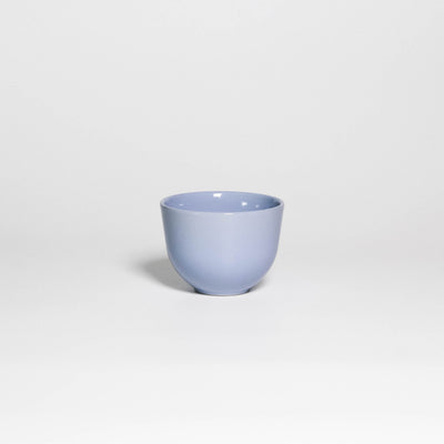 Coffee Cup Yun Iceblue, handleless stoneware cup with glossy ice blue glaze, front view