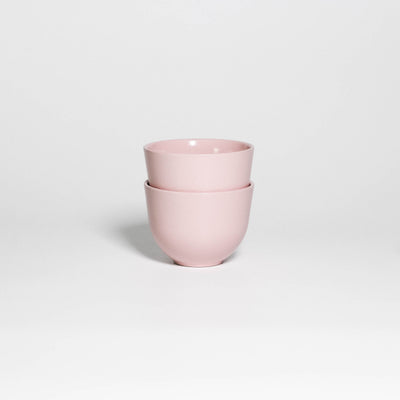 Two Coffee Cups Yun Pink stacked, handleless stoneware cups with glossy soft pink glaze