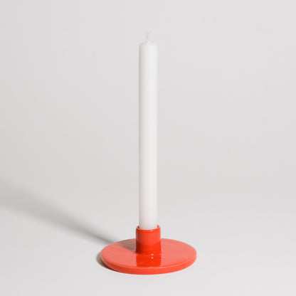 Candle Holder - Red showcasing a white candle held by a smooth, red-glazed stoneware base for modern home decor.