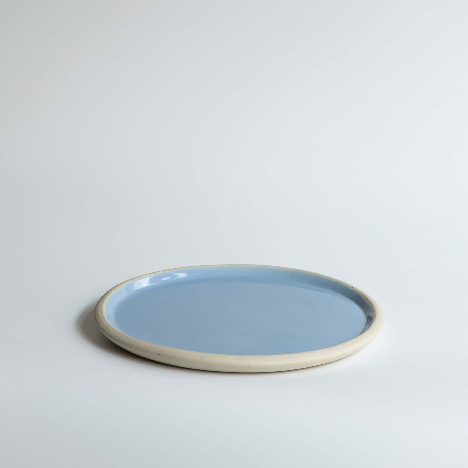 Handbuilding Plate – Iceblue made of durable stoneware with glossy ice blue glaze finish.