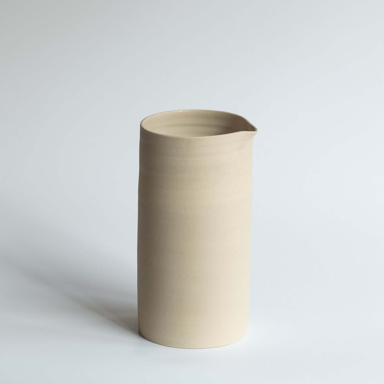 Carafe – Creme handcrafted carafe in a unique creme glaze, perfect for serving beverages.