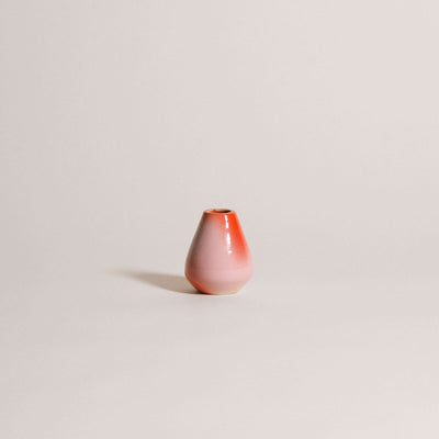Matcha whisk holder crafted from grey stoneware, featuring a pink and red airbrushed gradient, perfect for bamboo whisk.