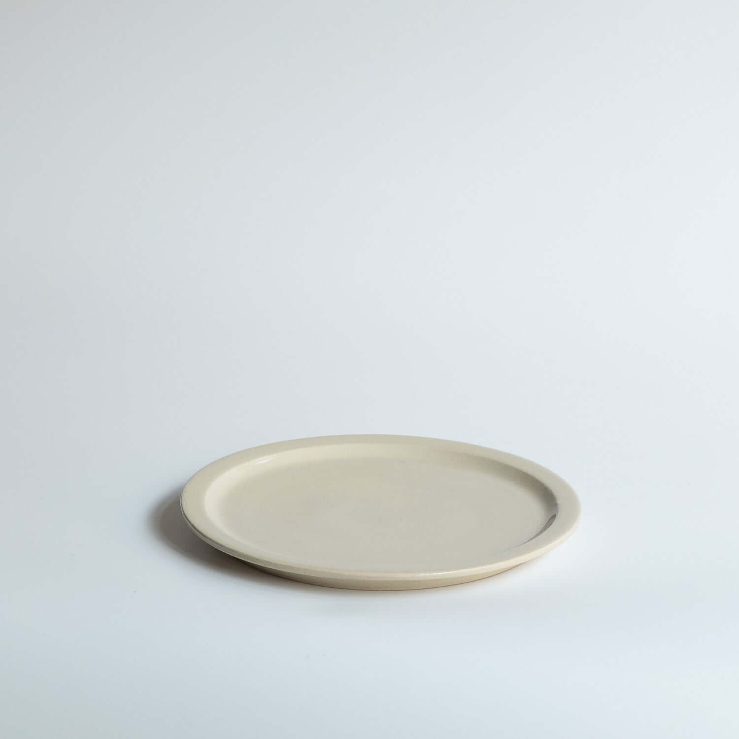 Bistro Plate - Creme, handmade ceramic plate with a unique creme glaze, ideal for everyday meals.
