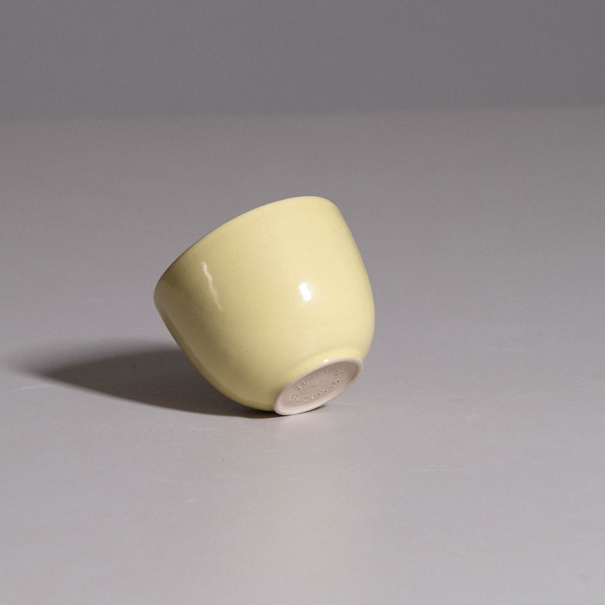 Coffee Cup – Yun Neon Yellow made from handmade ceramic showing its vivid yellow glazed surface.