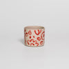 Video of the hand-painted red coffee cup by Viola Beuscher x Steffi Bauer, turning to show the illustration all around