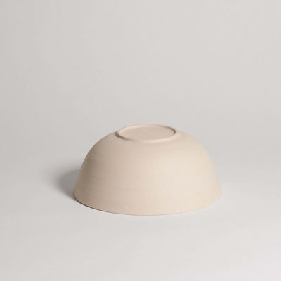 Ramen bowl in grey stoneware clay with glossy glaze on the inside and raw finish outside, perfect for serving.