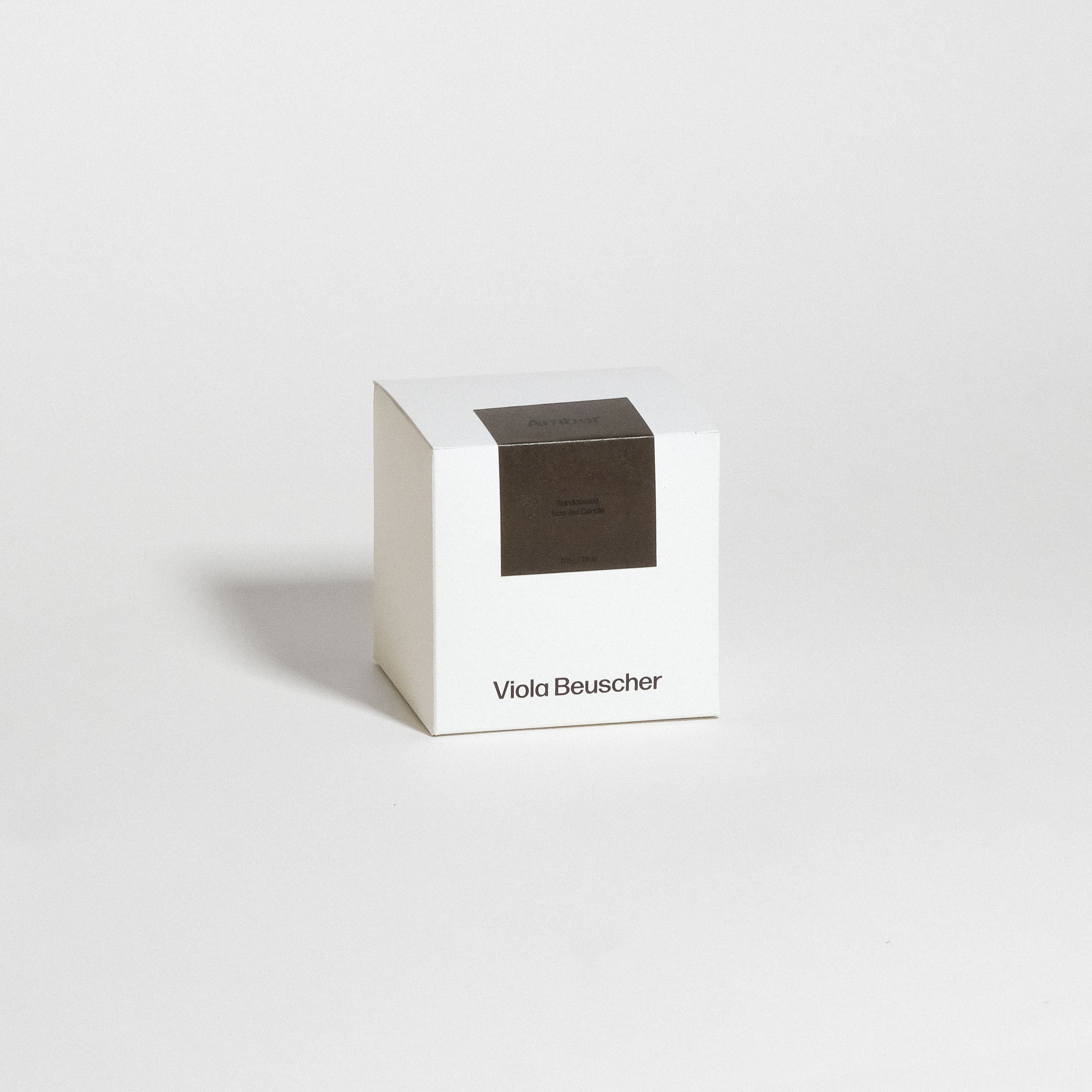 Scented Candle – Sandalwood – Amber in a white box by Viola Beuscher, showcasing elegant design and packaging.
