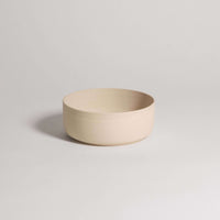 Set of 4 Nomi Creme breakfast bowls in grey stoneware with glossy glaze inside and raw exterior.