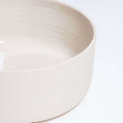 Nomi Creme breakfast bowl set featuring glossy interior and raw stoneware exterior, perfect for stylish dining.