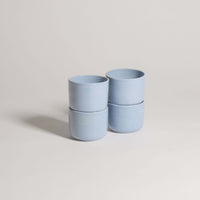 Set of 4 Nomi Iceblue coffee cups, handcrafted stoneware ceramic, showcasing unique iceblue glaze finish.