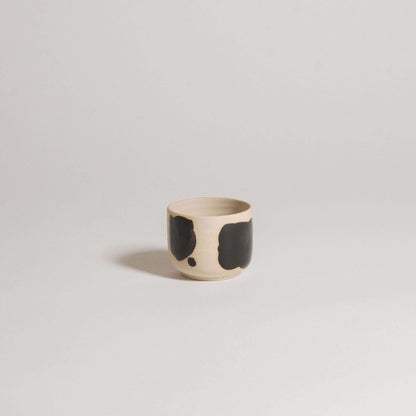 Set of 4 Nomi Pepe espresso cups featuring grey stoneware with glossy black brush strokes.