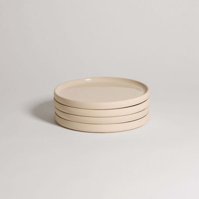 Set of 4 handcrafted breakfast plates in creme, made from durable stoneware ceramic with a transparent glaze.