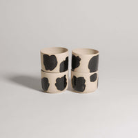 Set of 4 wheel-thrown coffee cups in grey stoneware, hand-painted glossy black brush strokes on the exterior.