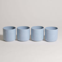 Set of 4 Nomi Iceblue handcrafted tea cups in durable ceramic, showcasing a unique iceblue glaze.