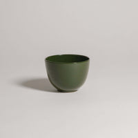 Handcrafted Yun Green coffee cup, made of durable stoneware ceramic with a unique glaze finish.